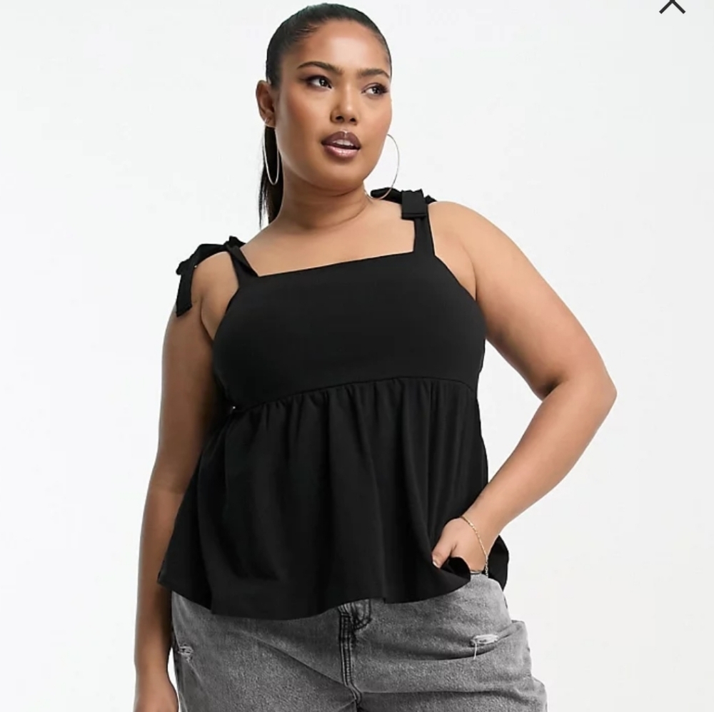 Never worn Black peplum tank